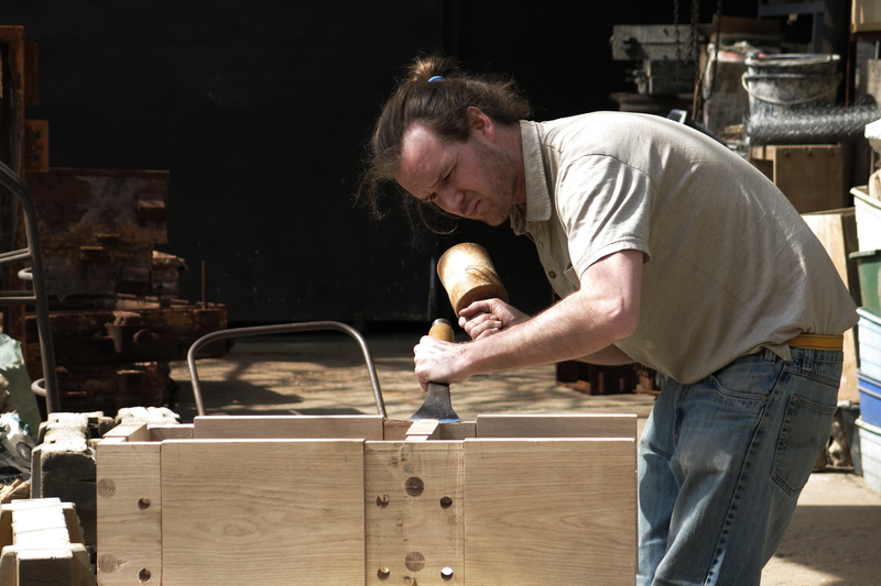 Illustration for article titled Casting Molten Metal On Wood With a Hungarian Design Master